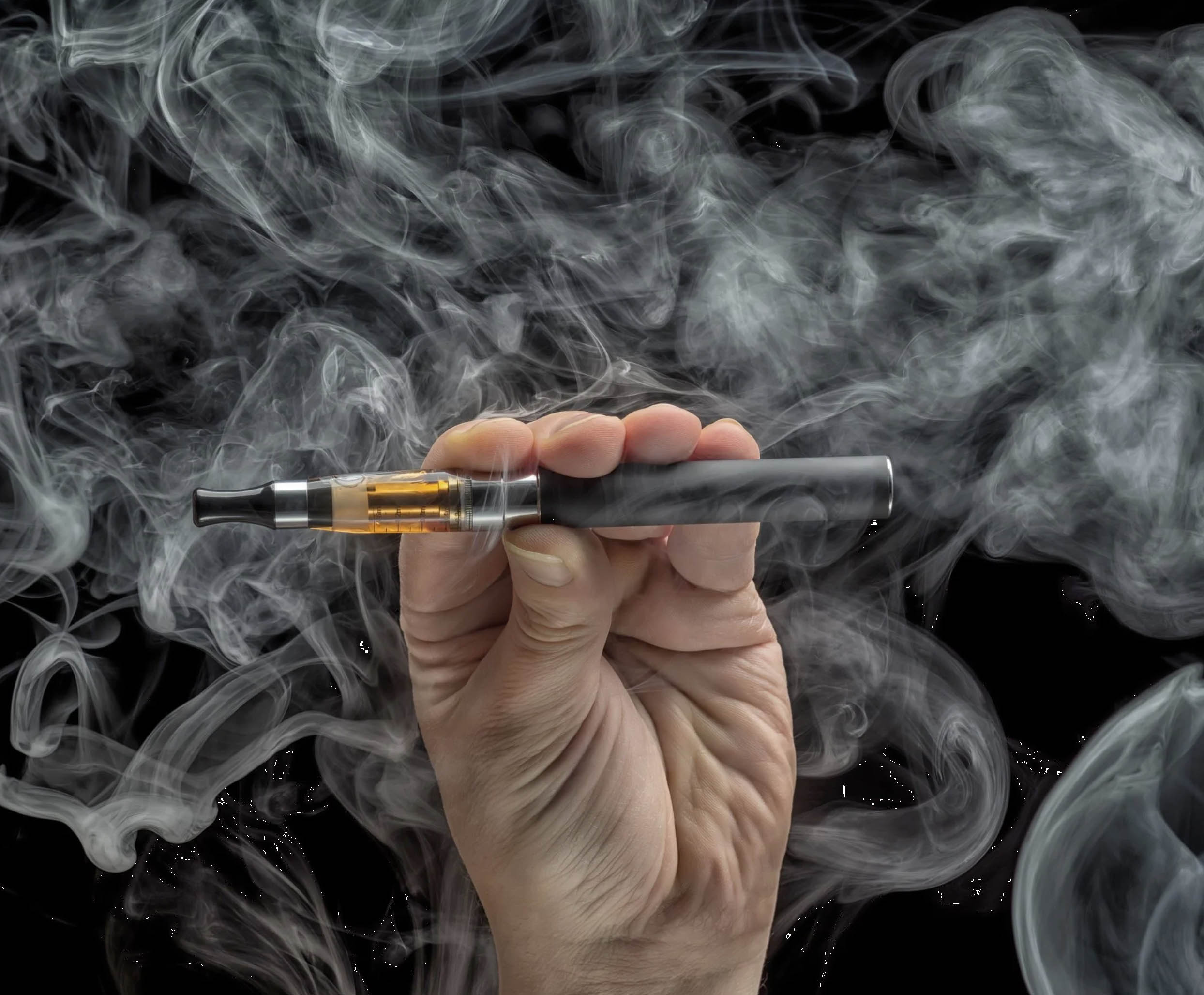 ACGrace - A hand holding an electronic cigarette with smoke coming out of it.