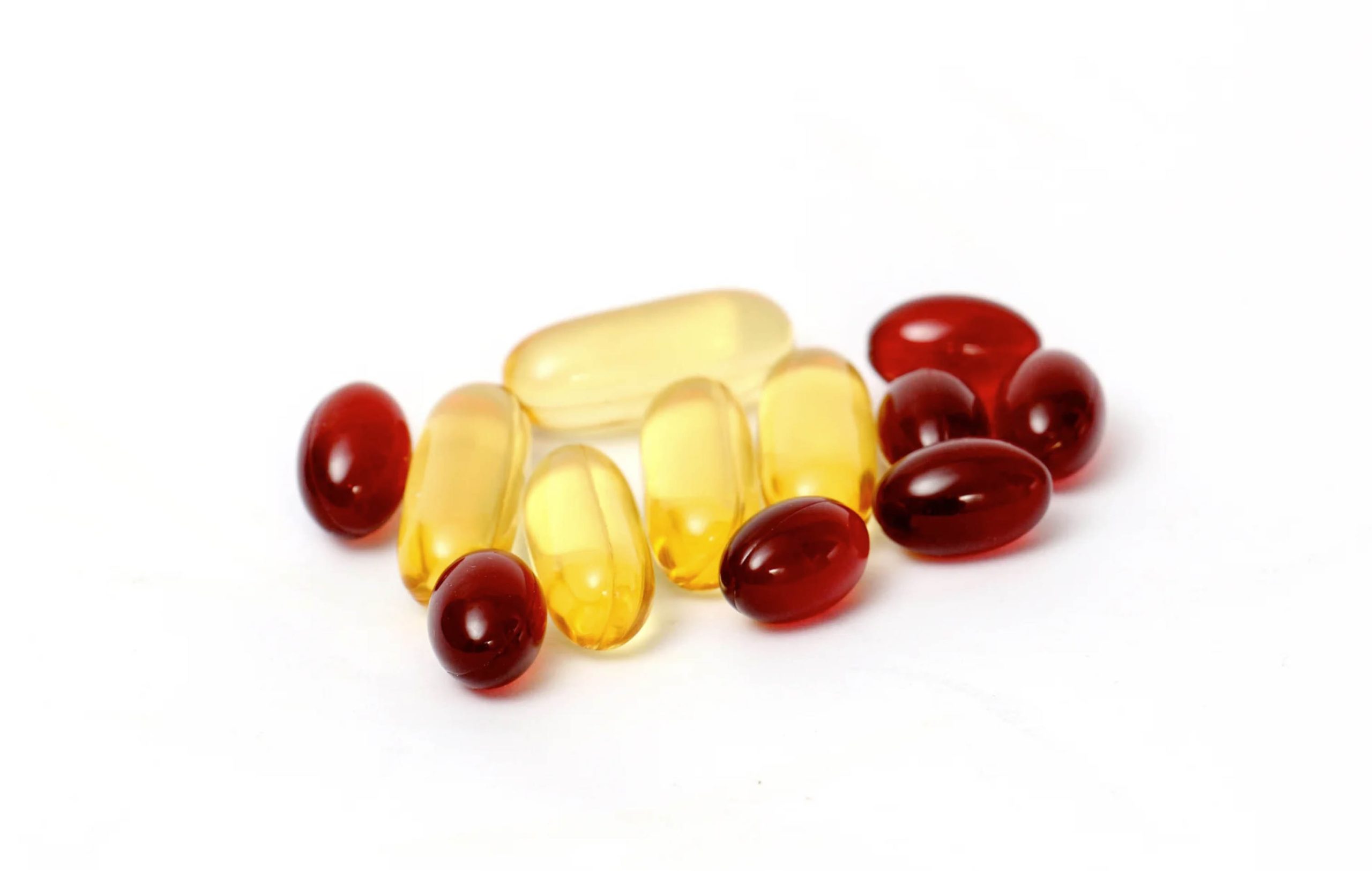 ACGrace - A group of fish oil capsules on a white background.