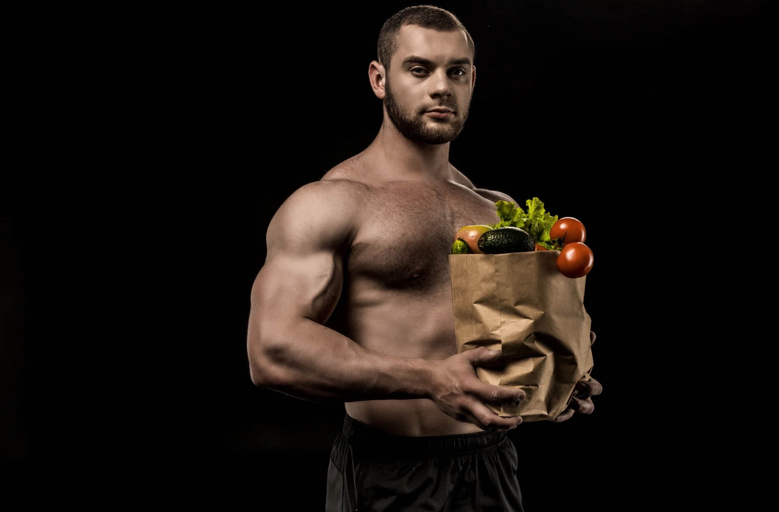 ACGrace - A muscular man holding a paper bag full of vegetables.