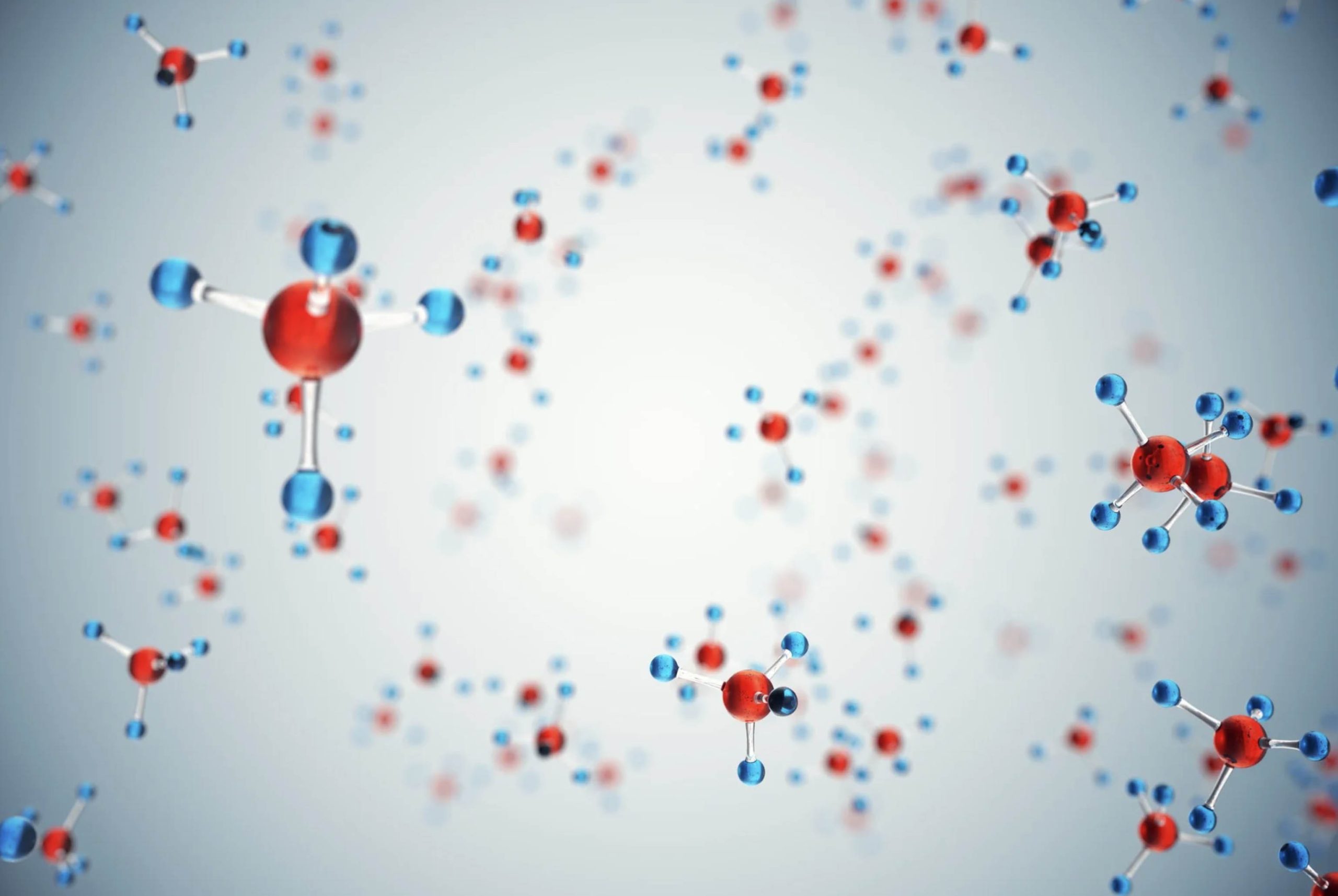 ACGrace - A group of blue and red molecules floating in the air.
