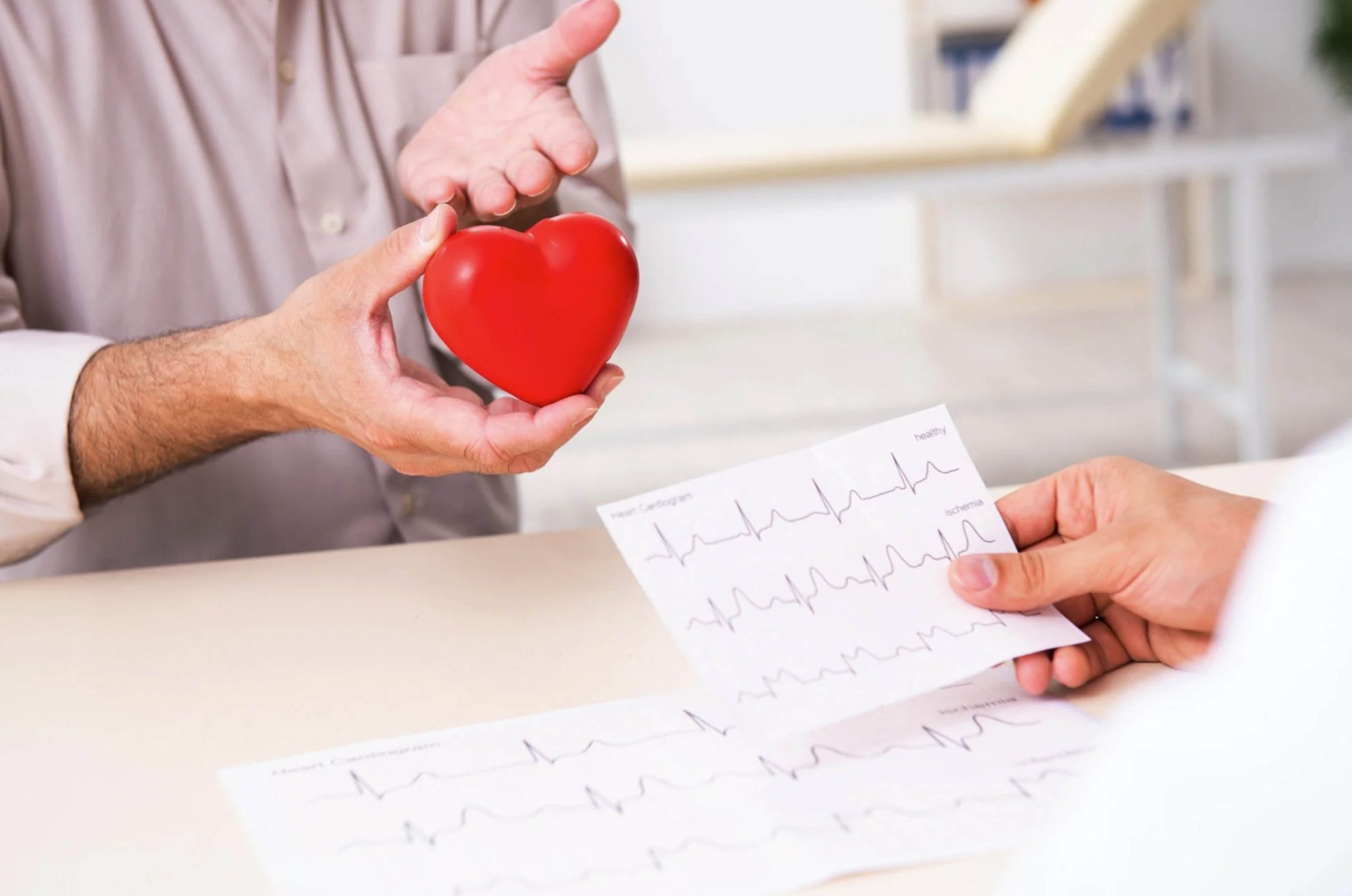ACGrace - A man is giving a red heart to a patient.